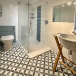 Halton Property Service; Large double shower with screen and tiled flooring
